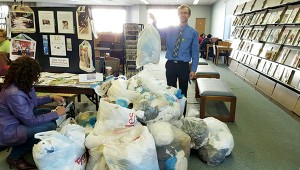 Photo Credit: Suffolk News Herald Wayne Jones, litter control coordinator and spokesperson for Keep America Beautiful, stands at Morgan Memorial Library with some of the bags full of plastic bags that were collected during a recycling event on Saturday.
