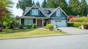 a large blue and white home