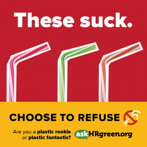 A series of plastic straws with the words "These Suck" behind them